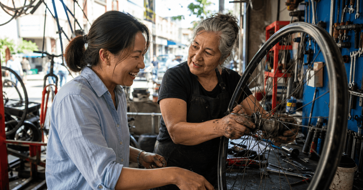 A career changer learns bicycle repair from an experienced mechanic in a busy neighborhood workshop